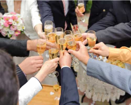 guests toasting champagne at a wedding